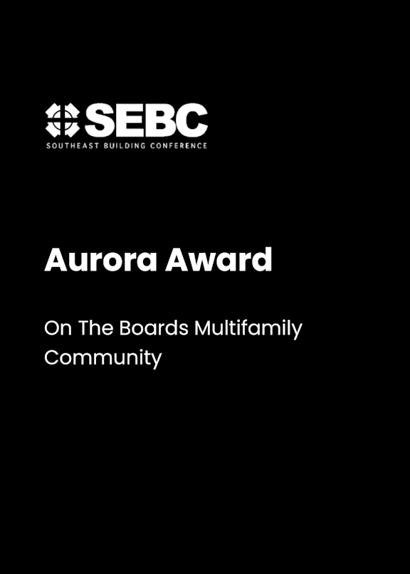 A black poster with the words "Aurora Award" and "On The Boards Multifamily Community" written on it.