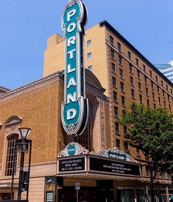 The Portland building has a blue and white sign on it.