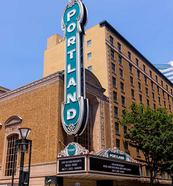 The Portland building has a blue and white sign on it.