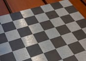 Thumbnail 4 of 7 - a black and white chess board on a wooden floor