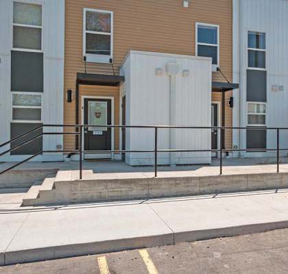 a picture of a building with a ramp in front of it