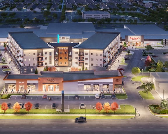 an aerial rendering of a hotel and apartments at night