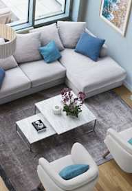 an aerial view of a living room with couches and chairs and a table