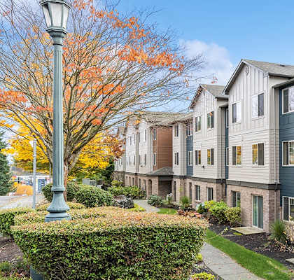 Exterior of apartments and lawn Exterior of apartments at Alderwood Court Apartments in Lynnwood WA