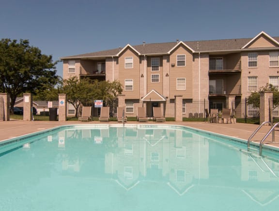 Outdoor pool with view of pergola at Eagle Run Apartments in northwest Omaha 68164