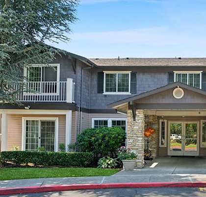 Front entrance at Woodlands at Forbes Lake Apartments in Kirkland WA