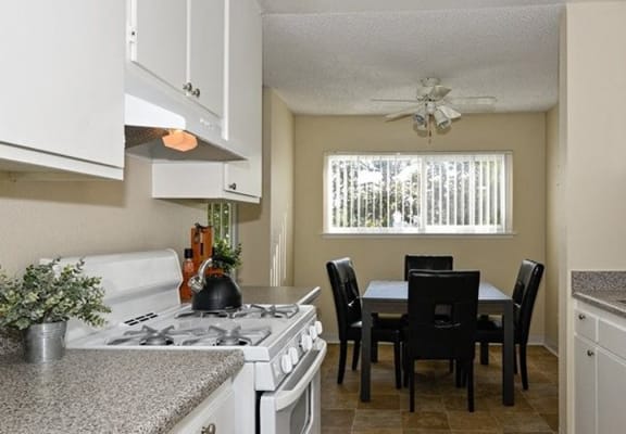 white kitchen cabinets  at Canyon Rim Apartments in San Diego, CA