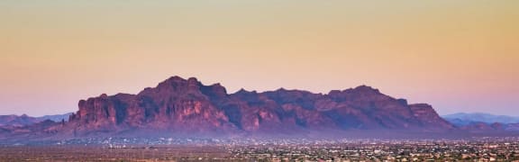 a view of the city and the superstition mountains