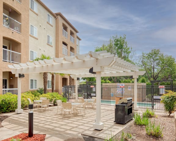 Outdoor Seating and Grilling Area at Hayward Village Senior Apartments