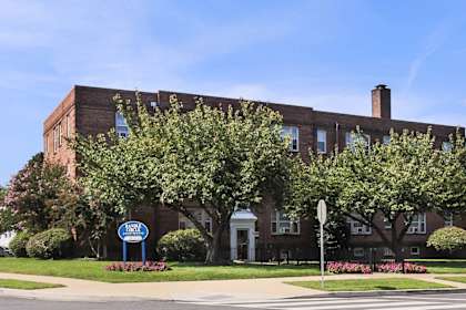 A street view of a building with a sign that says "New Beginnings".
