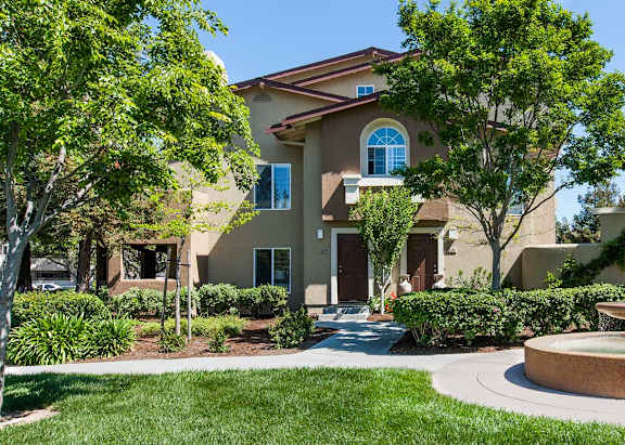 A house with a fountain in front of it at The Woods Apartments, San Jose, 95136
