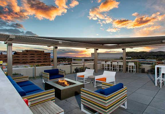 Rooftop seating area with firepit at Imperial Hardware Lofts, Riverside, CA, 92501