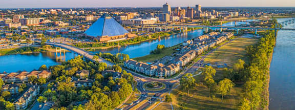 A cityscape with a river running through it.