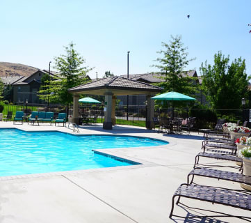 Pool with lounge chairs and umbrellas