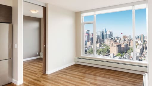 Empty living room with stunning view of downtown calgary