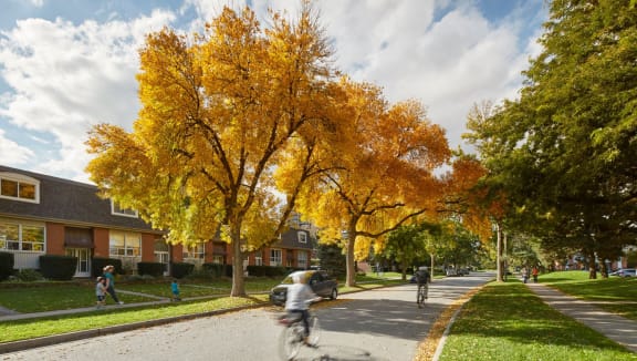 Georgian Court townhome exterior surrounded by beautiful fall trees.