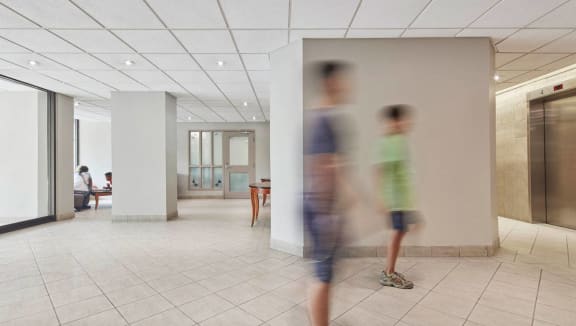 Large lobby and waiting area in front of elevators