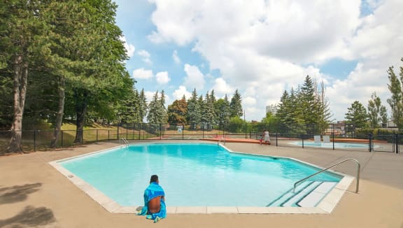 Outdoor pool with surrounding patio.
