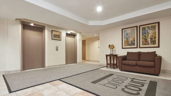 Lobby with seating and elevator access