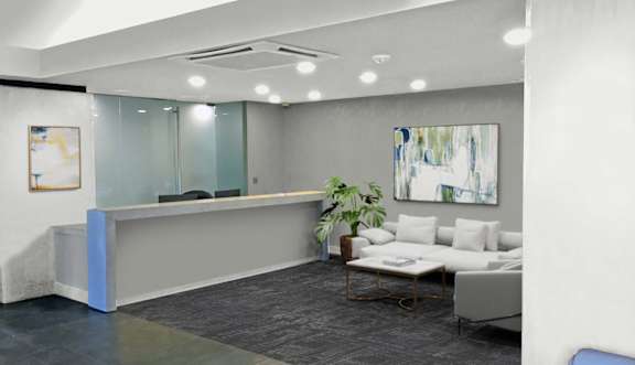 A waiting area with chairs and a plant.