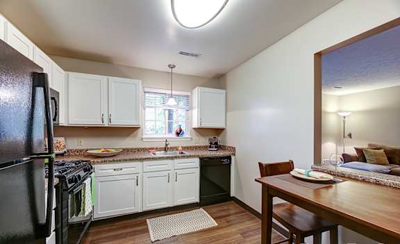 Fully-equipped kitchens with sleek black appliance package