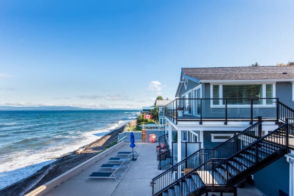 a house on the beach overlooking the ocean