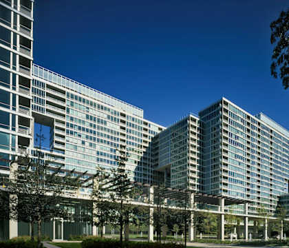 an exterior view of a large building with a clear blue sky in the background