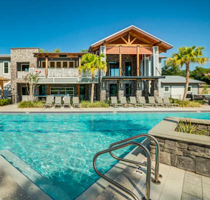 a swimming pool in front of a house with a pool at Century Town Center, Florida, 32607