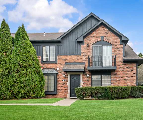 A large house with a black door and windows.