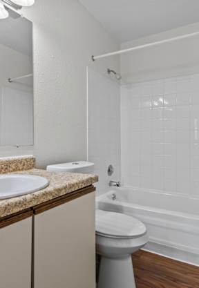 a laundry room with washer and dryer available in select units