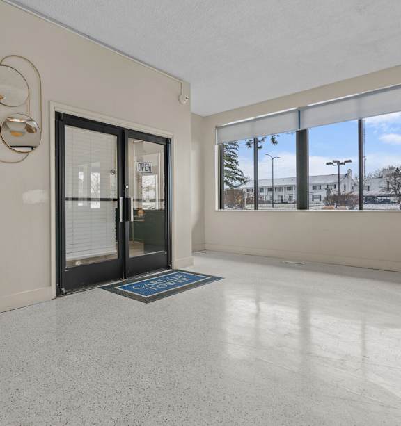 the preserve at ballantyne commons living room with glass doors and windows