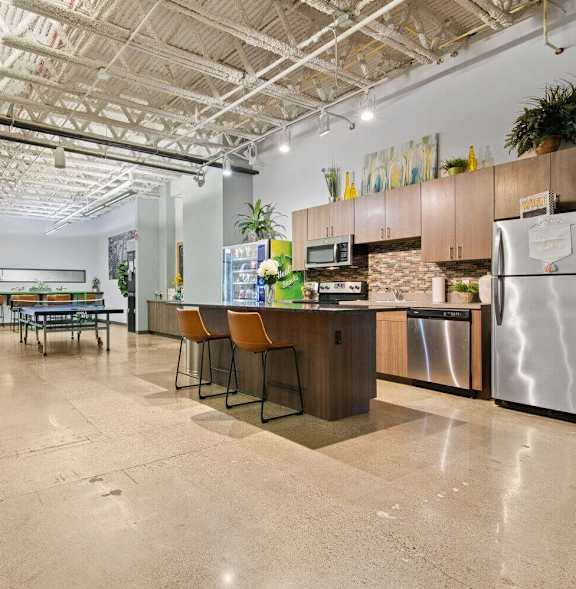 a living room with a kitchen and a dining room