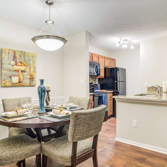 Apartments in Marietta Georgia for Rent – Wood Pointe Apartments - A dining room with a table set for four.