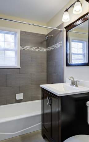 A bathroom with a white sink and a bathtub at Rivercrest Apartments, Piscataway , NJ, 08854