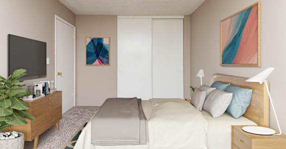 a bedroom with a bed and a tv