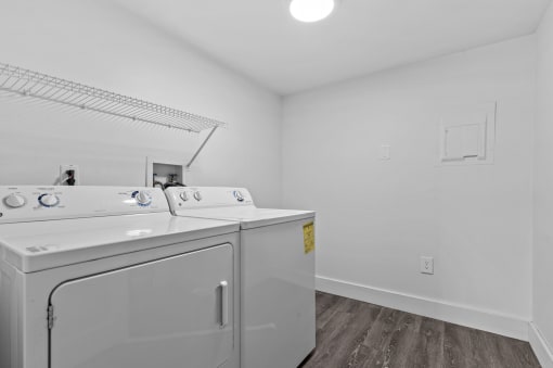 a laundry room with a washer and dryer