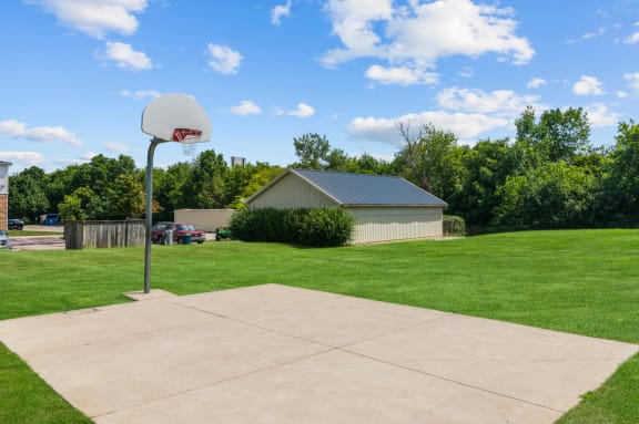Half-Court Basketball Court at Residences at Grand Blanc Apartments - Grand Blanc, MI, Grand Blanc Twp