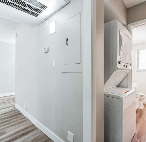 a bathroom with a washer and dryer