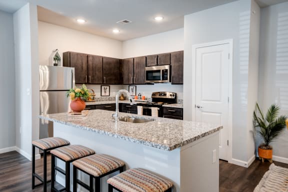 an open kitchen and dining room with a table and chairs