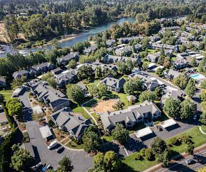 an aerial view of a neighborhood with houses and trees