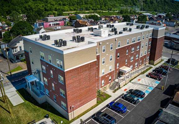a large brick building with a white roof
