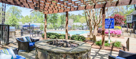 Apartments in Marietta Georgia for Rent – Wood Pointe Apartments - A patio with a fire pit and seating area.