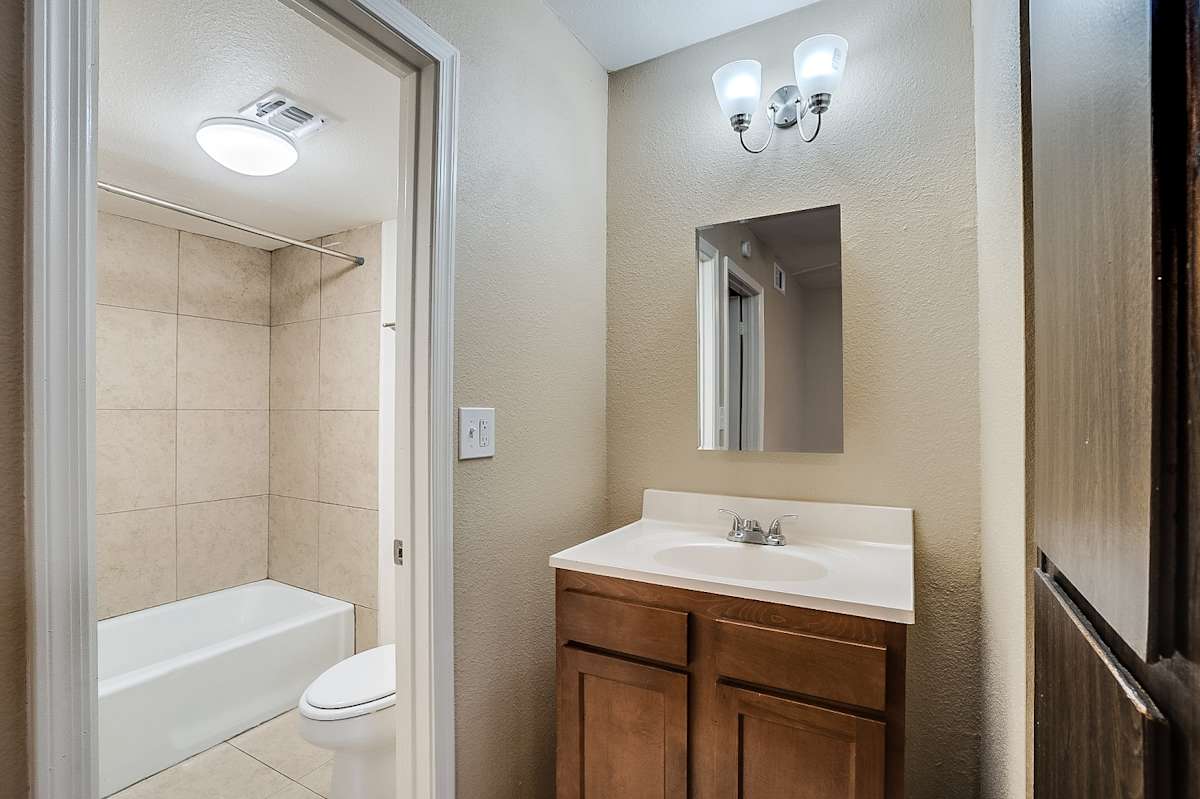 Apartment bathroom — representative home at Canberra Apartments.