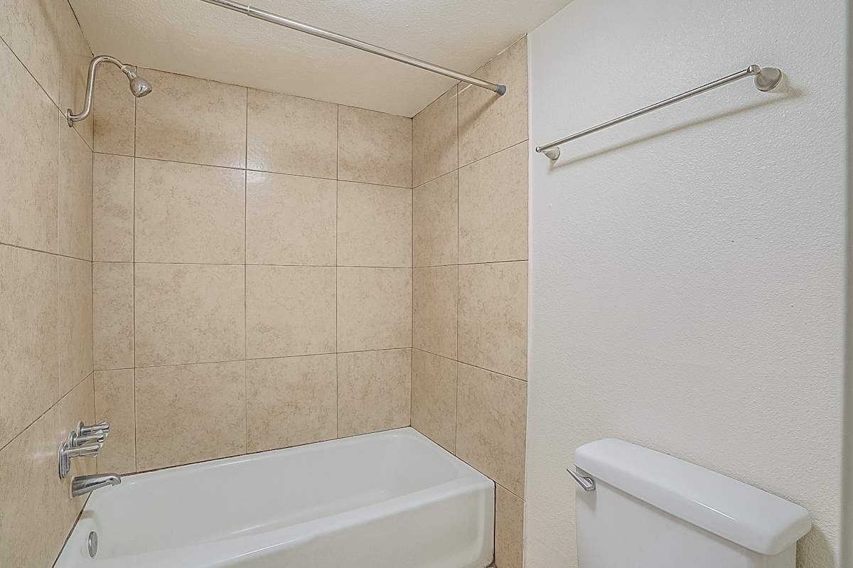 Apartment bathroom — representative home at Canberra Apartments.