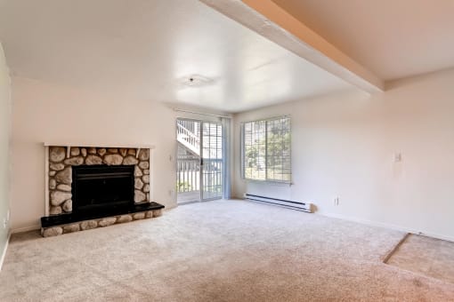 Our Apartments Living Room and Fireplace at Newport Heights Apartment in Tukwila Washington