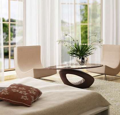 a bedroom with a bed and a table and a television