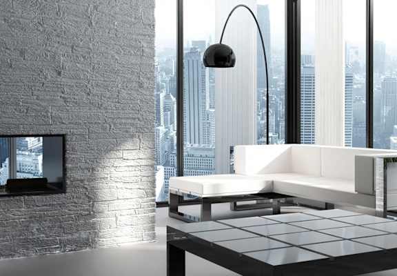 a living room with a white couch and a large window