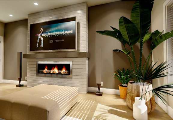 A living room with a flat screen TV mounted above a fireplace.