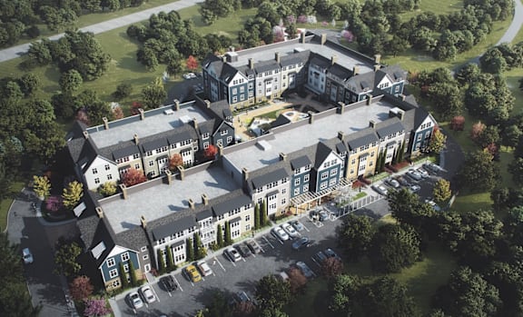 an aerial view of building with car parking at The Villages at Saugatuck, Connecticut  , 06880