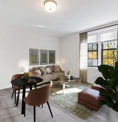 a living room with a couch and a table and chairs